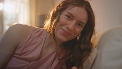 happy girl holding giftbox in morning closeup. cheerful woman unwrapping present