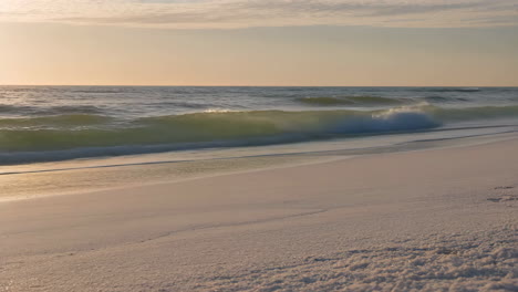 beach with waves at sunset