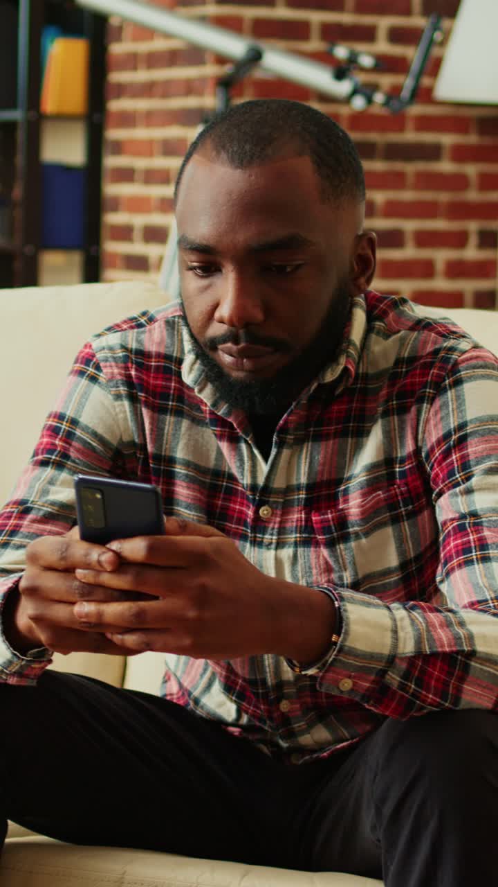 Man using a phone at home
