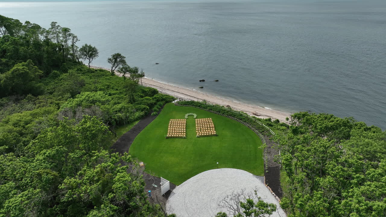 Lush Green Forest And Wedding Ceremony Setup By The Ocean At Breezehill Farm In Peconic, New York, USA. - aerial shot