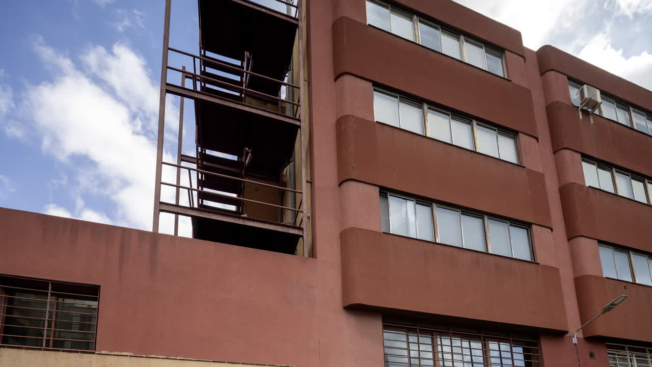 Old factory and industrial complex with passing clouds