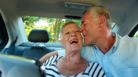 senior couple reviewing picture on mobile phone 4k