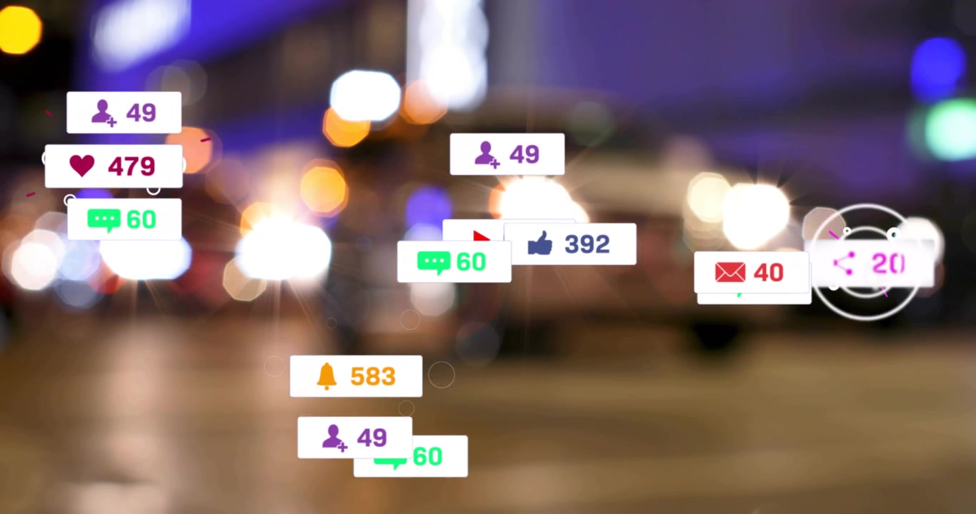 Incoming alerts filling night bokeh with social icons and counts over two people walking street