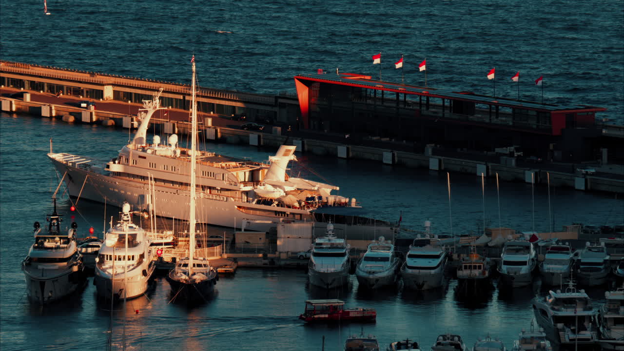 View of boats docked in the Monaco Marina in the evening