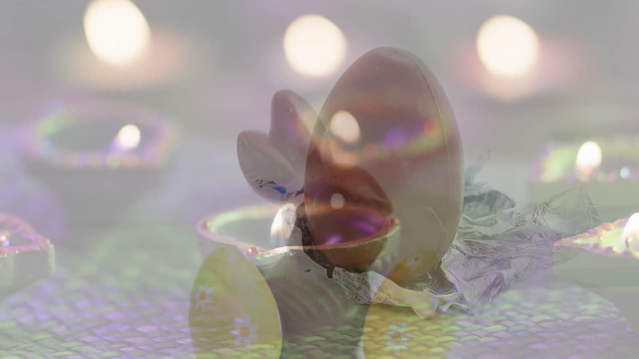 animación de huevos y luces cayendo sobre el conejo