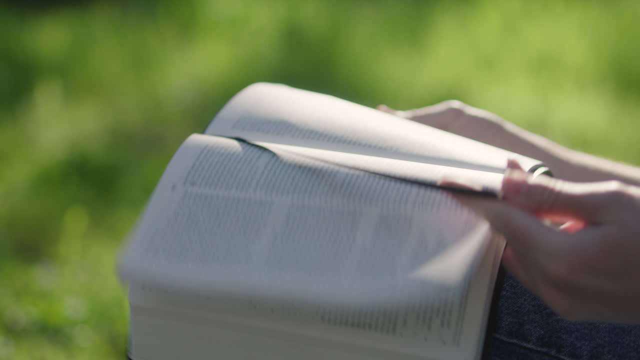 Reading a book outdoors