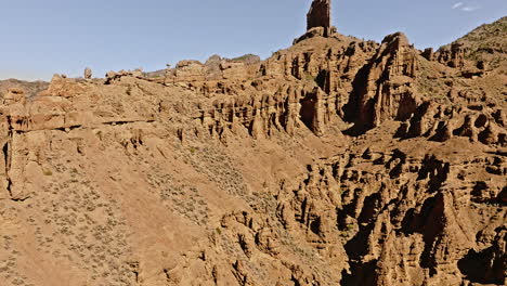 Drone shot flying towards rugged canyon in the western United States