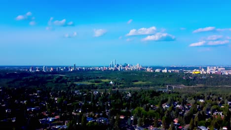 sunny summer edmonton south west flyover residential detached homes to north east downtown core over over the river and hawrelak park