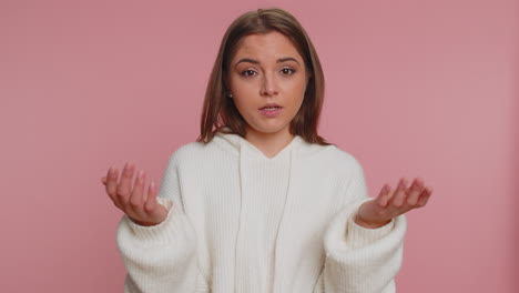 woman in white sweater with serious expression