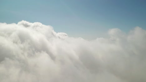 Flying-above-beautiful-thick-fluffy-clouds