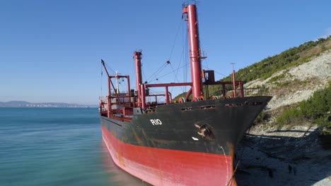 abandoned cargo ship on a coastal cliffside