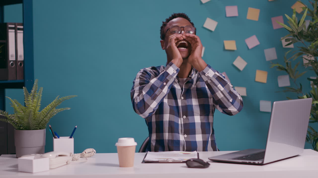 Freelancer whispering secret and rumor sitting at desk