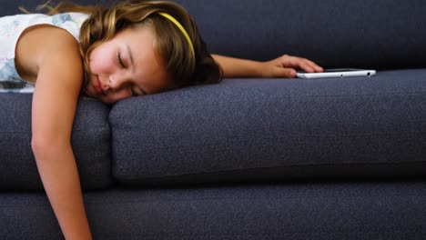 Girl-sleeping-on-sofa-in-living-room
