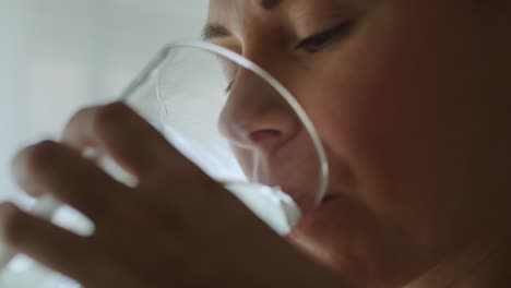 Handheld-video-of-pregnant-woman-taking-a-pill.