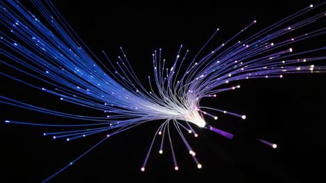 vibrant display of light and color from fiber optic filaments creating a dynamic visual experience against a dark background