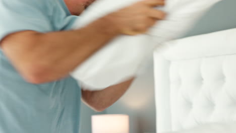 Happy,-love-and-couple-pillow-fight-on-bed