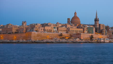 time lapse of the city of valletta in malta getting dark.