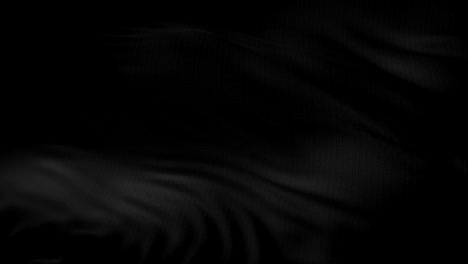 black textile fabric waving in the wind abstract background