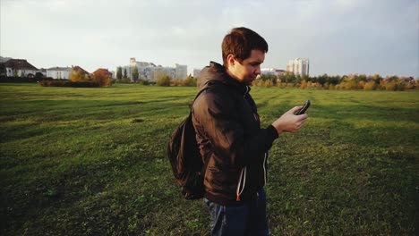 Man using a smartphone in a park