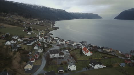 Aerial-shot-of-Utvik-village-located-on-shore-of-Norwegian-fjord