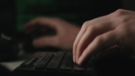 hacker is typing keys on a keyboard