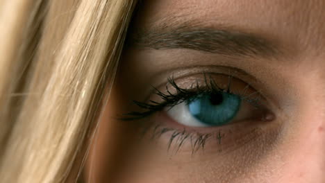 pretty blonde opening her eye close up