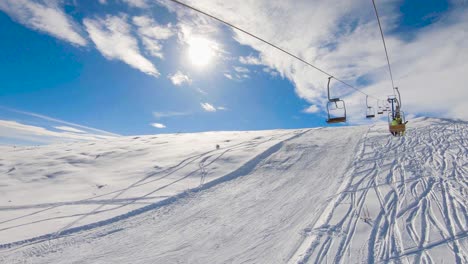 view on a ski resort from ski lift going to the top on a mountain