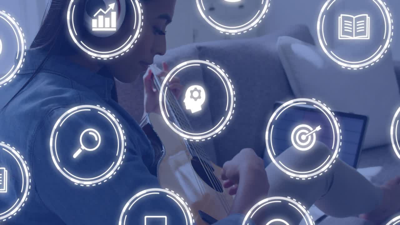 Female musician following laptop lesson, playing guitar while learning icons fading and overlapping