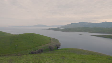 Time-lapse-of-Pacific-ocean-surrounded-by-green-lush-grass-located-by-the-Golden-Gate-National-Recreation-Area-San-Francisco-California