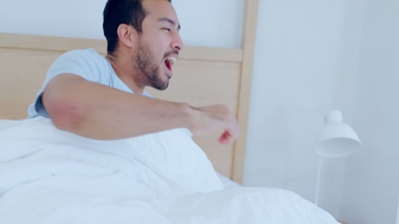 Happy man, bed and wake up in morning with yawn