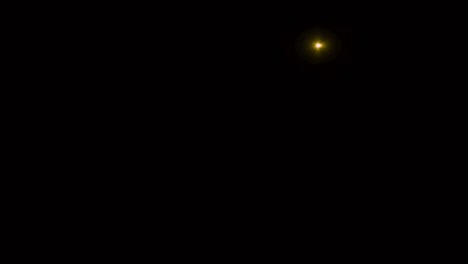 luz de destello realista sobre un fondo negro.