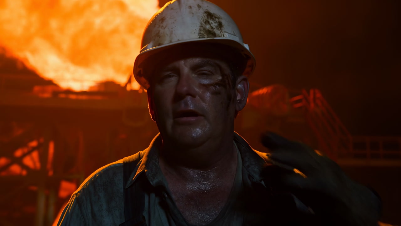 White Worker At Steel Mill Sweaty Foundry Operator Wearing Helmet, Soot Streaked Face, Intense Orange Molten