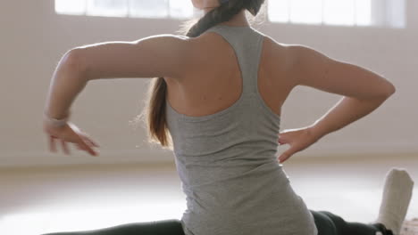 beautiful yoga woman exercising healthy lifestyle practicing wide-angle seated side bend pose enjoying workout in studio training mindfulness breathing exercise