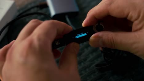 man using hardware cryptocurrency wallet ledger