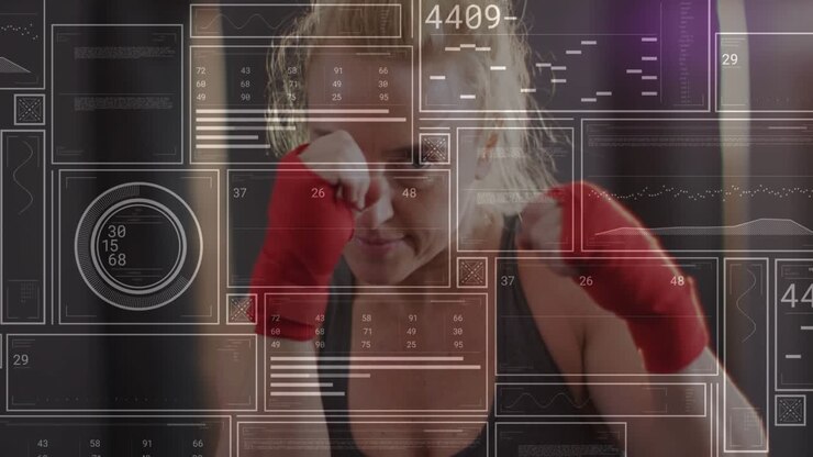 Female athlete raising hands and starting drill, throwing jabs and crosses while HUD tracking data