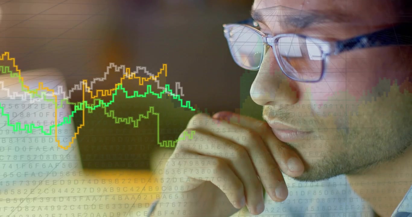 Analyst analyzing screen receiving and projecting charts reflecting in glasses for finance trades