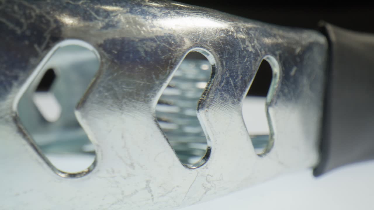 A clamp with macro video close up moving in a circle.