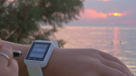 woman setting the date on smartwatch