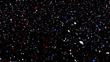Colorful-confetti-falling-against-black-background