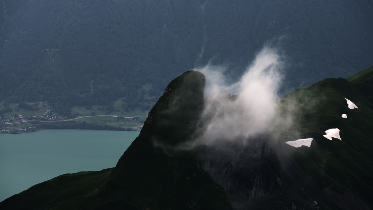 Misty Alpine Peak with Lake View