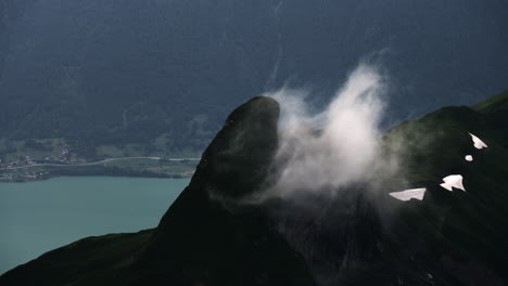 misty alpine peak with lake view