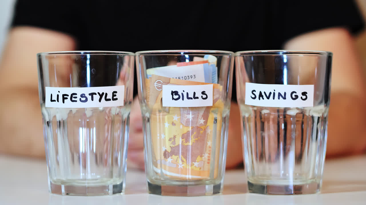 Man places entire cash stack into BILLS jar, full surrender to economic pressure