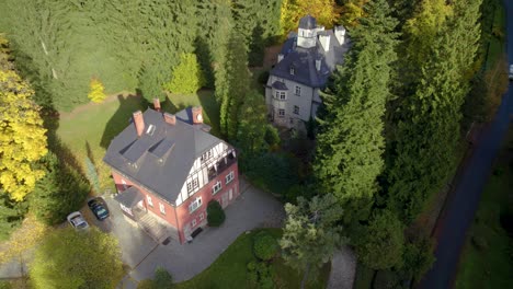 aerial shot of the xix century swiss-style villas in sudety mountains valley in poland, europe