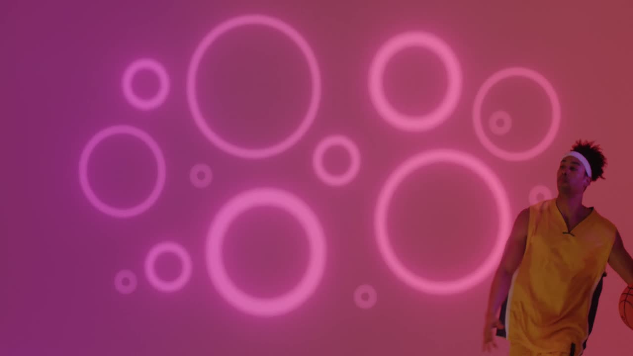 анимация розового неонового узора и двухрасового баскетболиста.