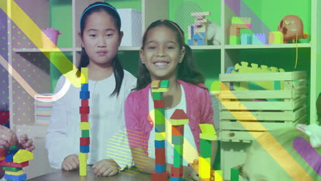 children building colorful block towers, geometric shapes animation over scene