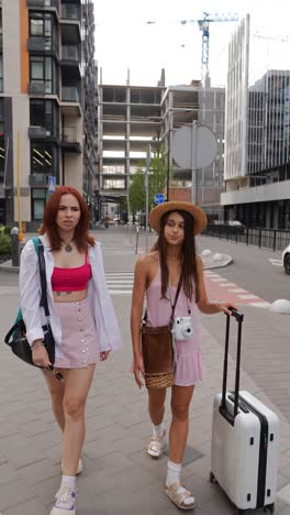 two women traveling in a city