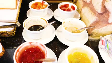 assorted sauces and bread on a table