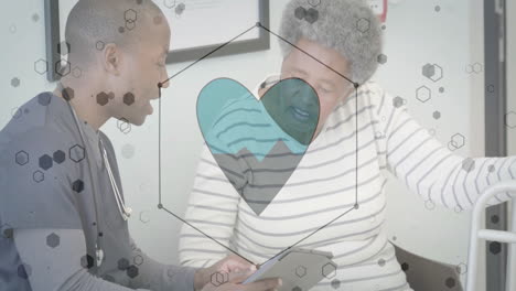 heart health animation over doctor and elderly patient discussing medical information