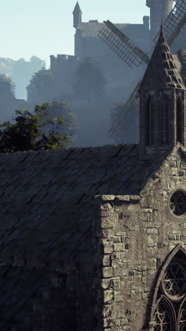 medieval village church and windmill scene