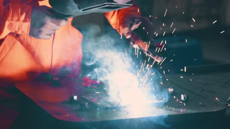 metal welder working with arc welding machine